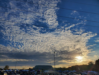Sunset on the clouds showing the parking lot of the Nutter Center concert venue.