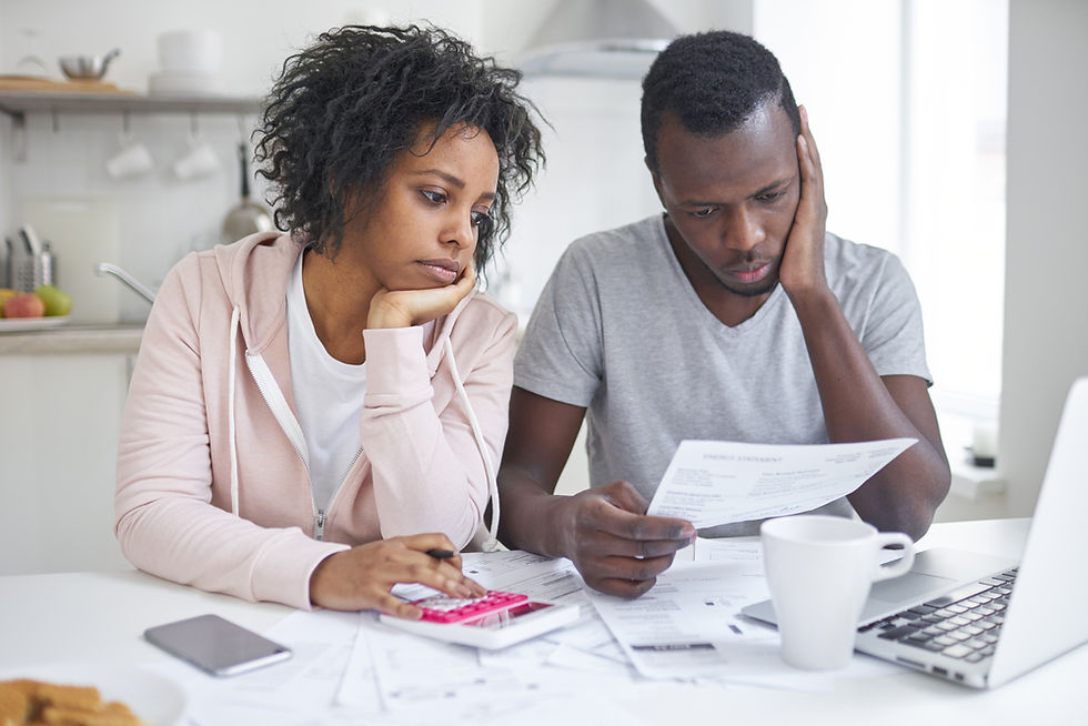 Young couple dealing with the emotional toll of monthly expenses and no end in sight. The Debt Action Plan changes that.