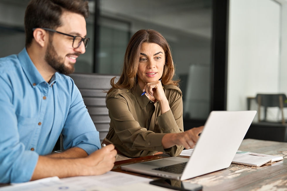 Older Woman reviewing her IUL with Living Benefits policy with her life insurance agent.