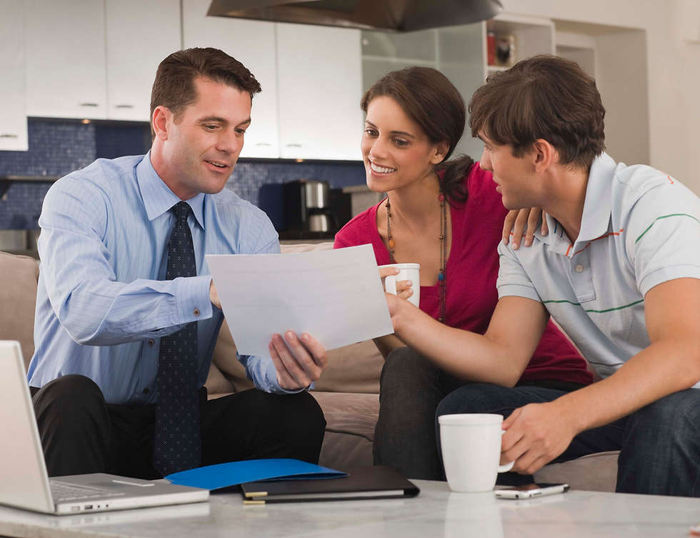 A financial advisor taking notice of the better than expected performance of a couple's IUL.