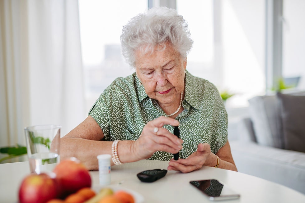Senior female checking her blood for blood glucose levels