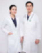 Two doctors (dermatologists) in white coats, one with a stethoscope. Both appear professional and calm.
