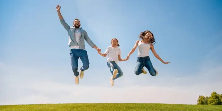 depositphotos_158688566-stock-photo-happy-family-jumping-on-meadow.jpg