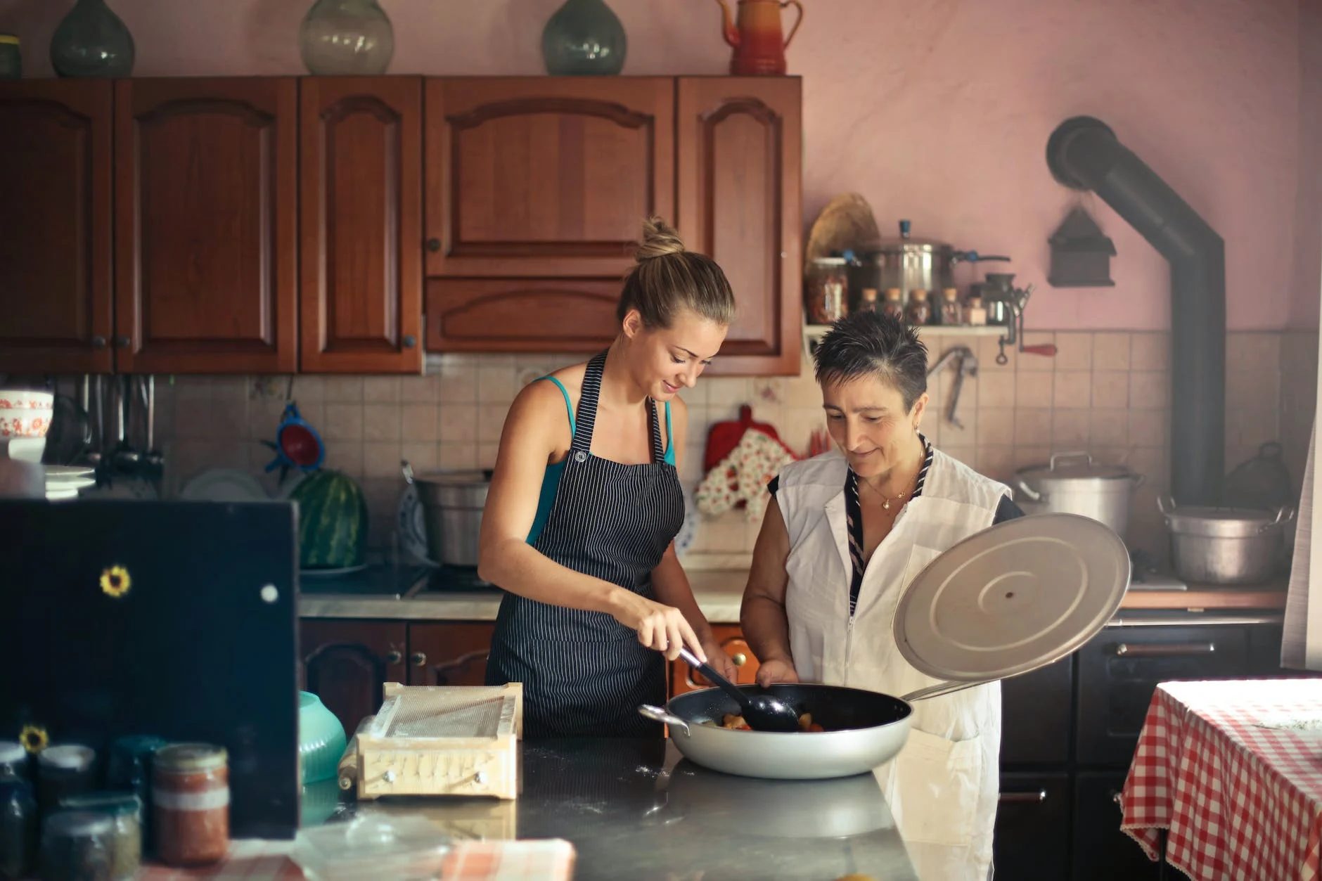 mom And Daughter Cooking In A Kitchen Photo by Andrea Piacquadio