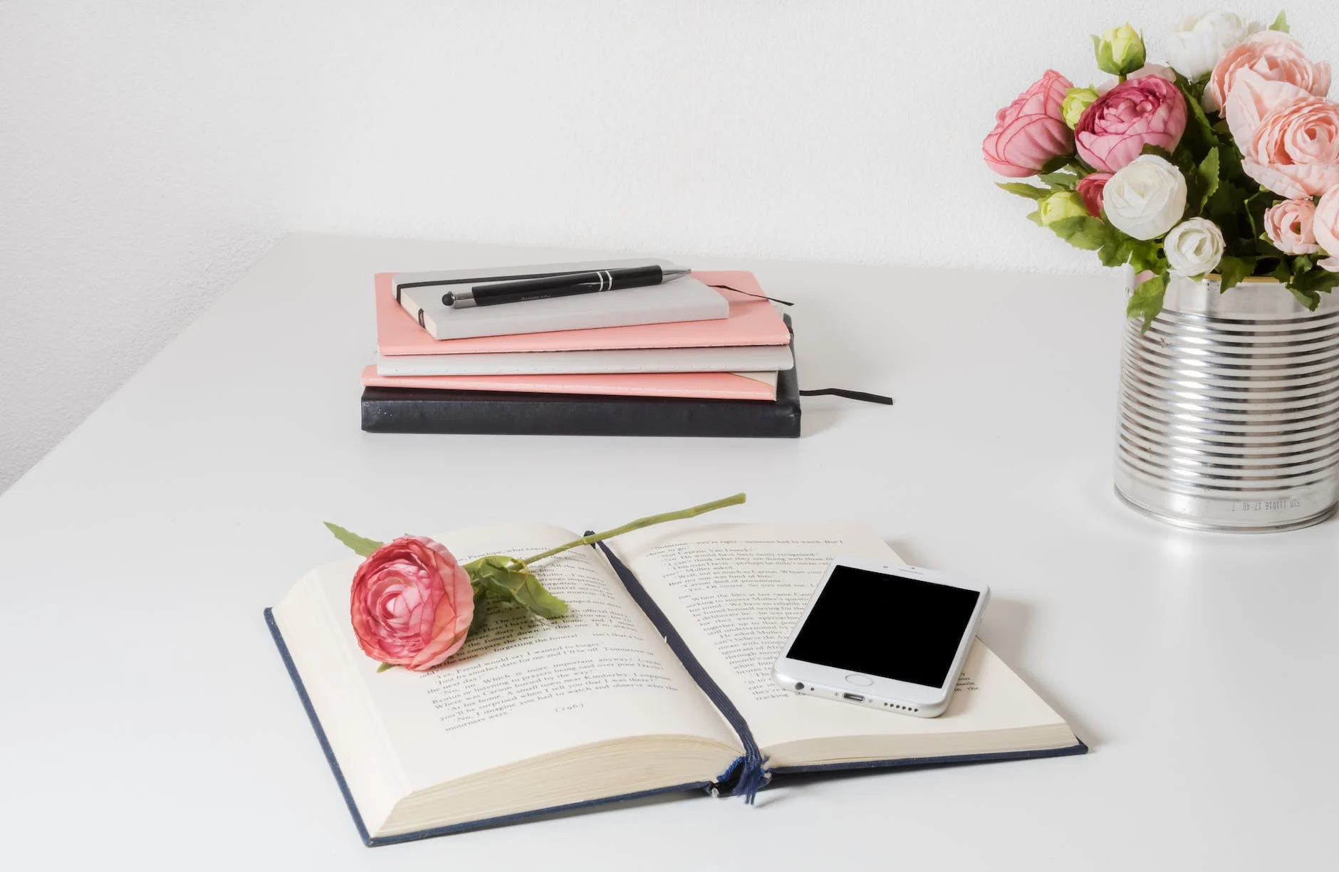 Book On A White Wooden Table (Photo by Ylanite Koppens)