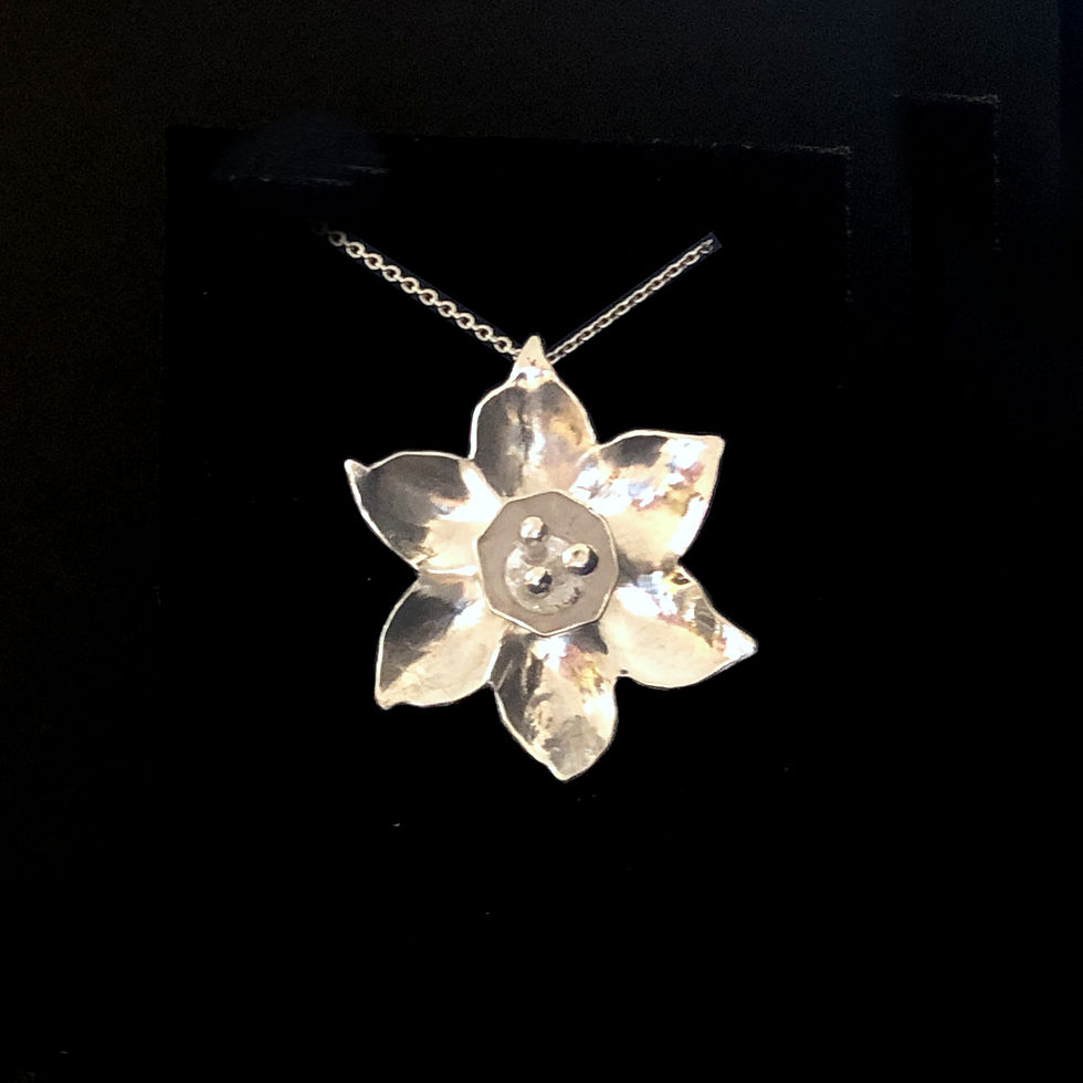 Thumbnail: Sterling Silver Daffodil Flower Pendant by Flying Silver Studio shown on a black background