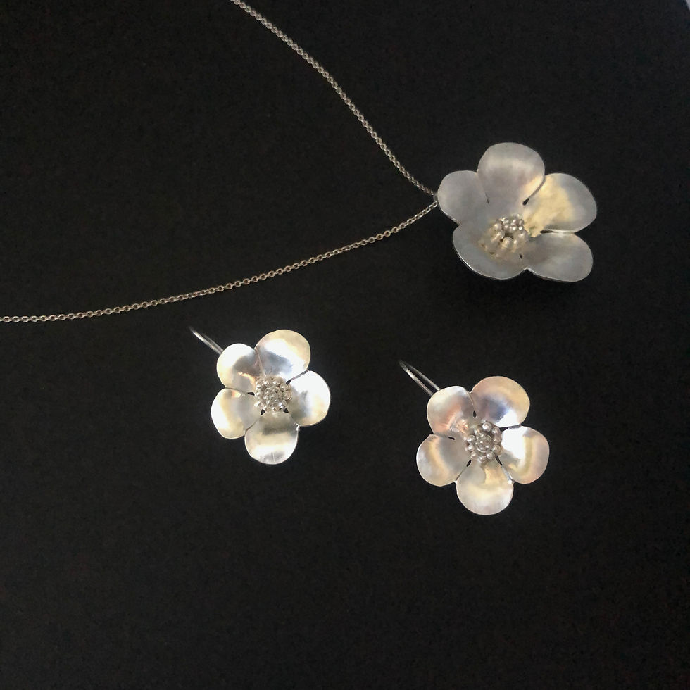Thumbnail: Sterling Silver Quince Flower Earrings and Pendant by Flying Silver Studio shown on a black background