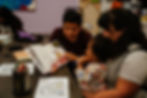 Family reading their child a book for the lil readers program