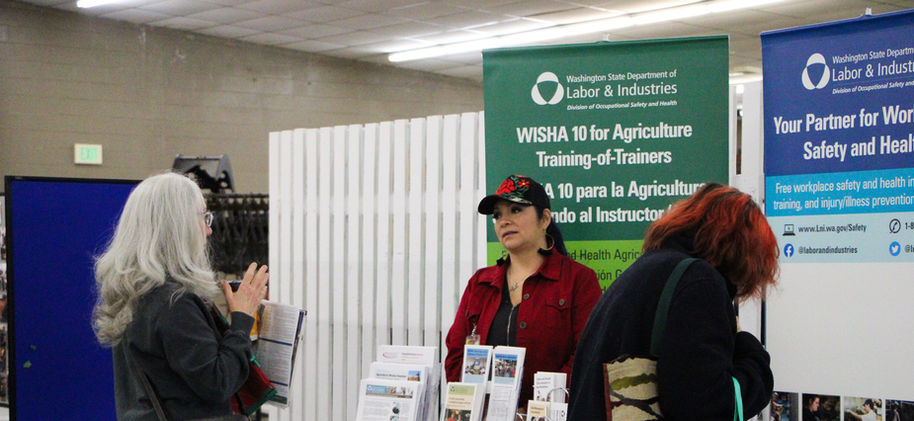 Exhibitor talking with visitor