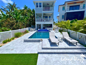 Linear Pool Project Featuring A Spillover Spa, Italian Marble Decking, And A Tanning Deck In Pinellas County