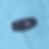 A blue JBL speaker floats in a clear, rippling swimming pool.