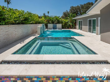 Geometric Pool Project Featuring A Fire Feature, Spillover Spa, 2 Cascading Water Features, And A Sunshelf In Hillsborough County