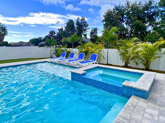 Linear Pool With Sunshelf and Chairs In Hillsborough County