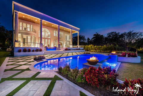 Roman Style Pool With Turf Inlay Decking and Fire Bowls