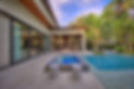 Custom Outdoor Living Space Featuring A 360 Spillover Spa, Shellock Decking, & Custom Outdoor kitchen