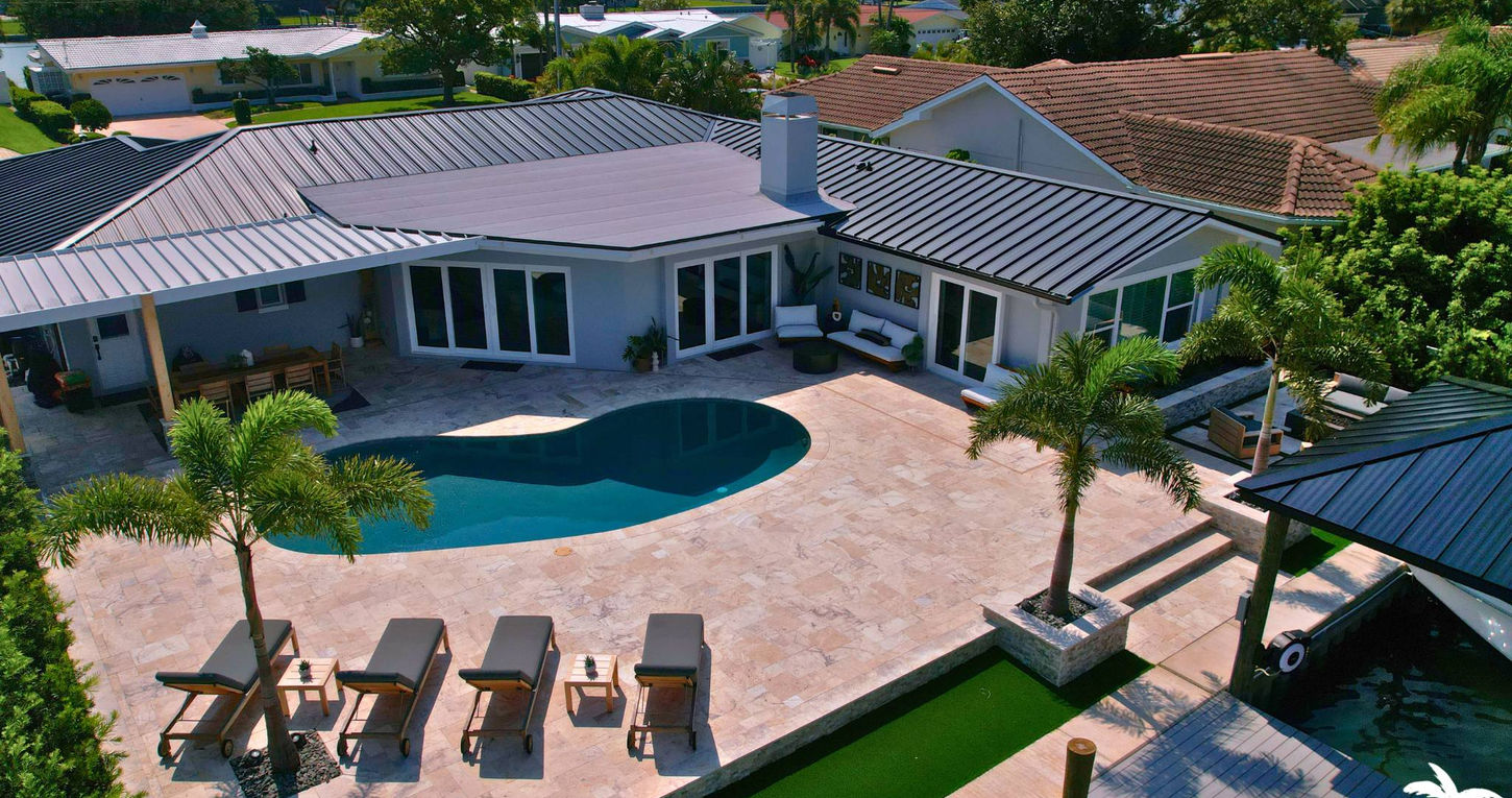 Freeform Pool Remodel Project With Travertine Decking And Artificial Turf In Clearwater Beach
