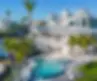 Infinity Edge Pool Project With a 360 Spillover Spa, Oversized Sunshelf, Fire Bowls, & Shellock Decking