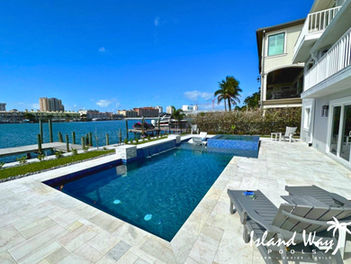 Geometric, Waterfront Pool Featuring A 360 Spillover Spa, Sunshelf, Custom Water Feature, & Marble Decking In Clearwater Beach