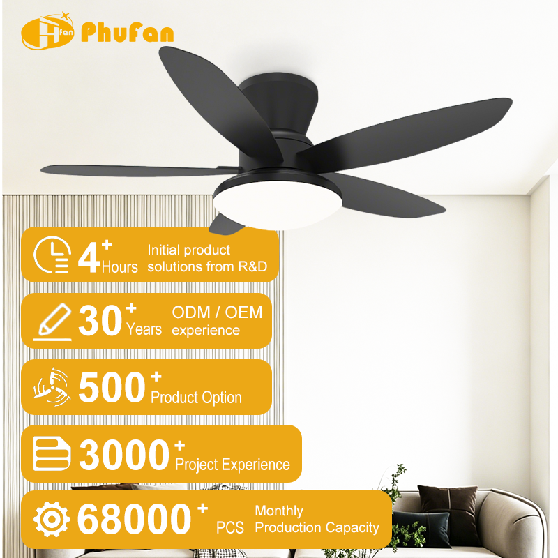 Low profile ceiling fan with light for living room, five black blades and a broad LED panel pictured above a sofa.