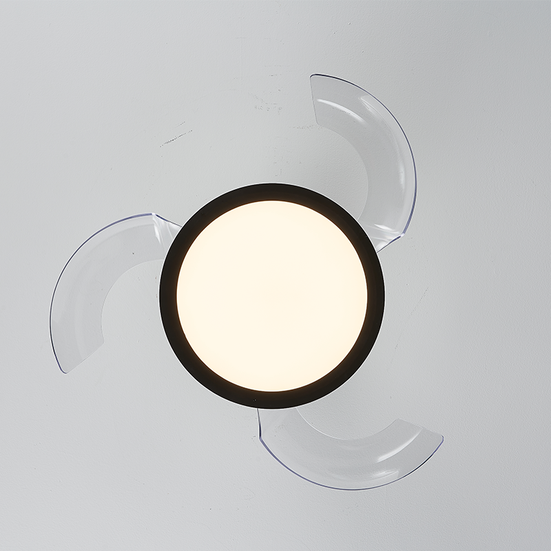 Bottom view of a black retractable fan light, showing three clear blades around the illuminated round LED panel.