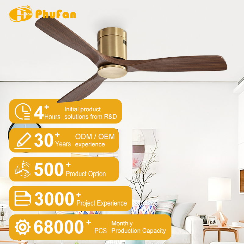 Hugger ceiling fan with light for bedroom, gold housing and three dark solid-wood blades pictured above a bed.