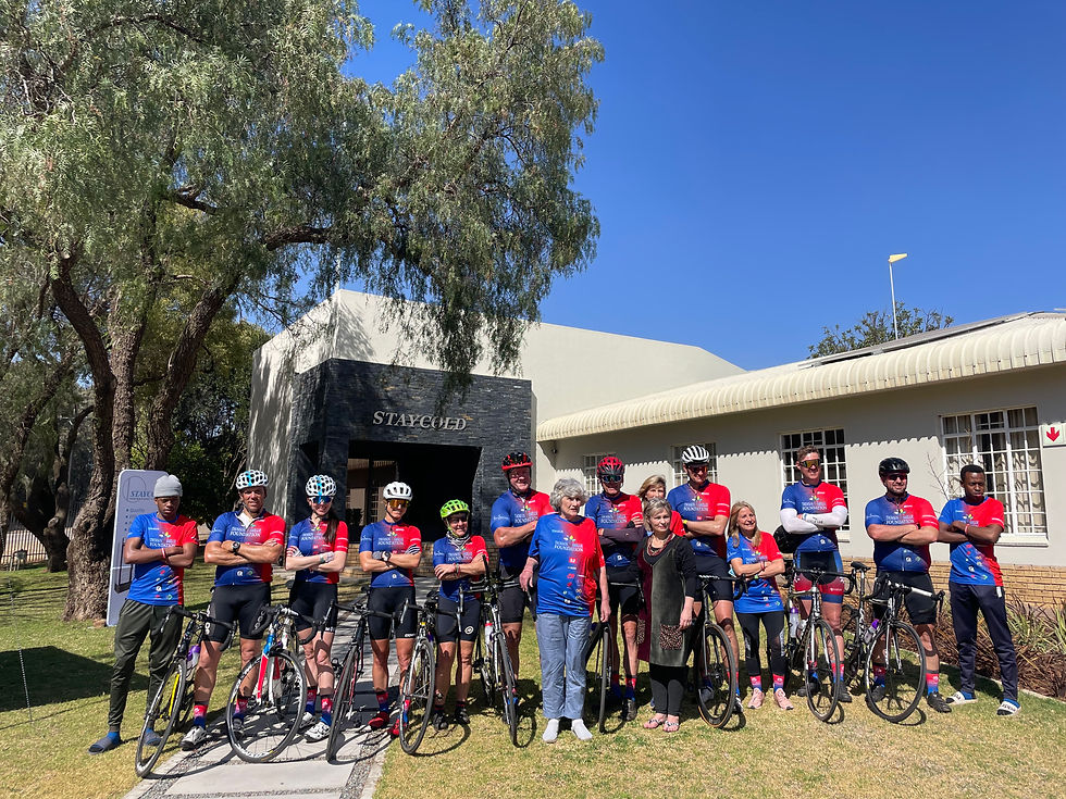 Thomson Smillie Foundation riders and support crew with Lena le Roux, MD Staycold International in front of Staycold’s facility.
