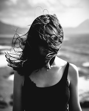Woman with Hair Blowing Over Face