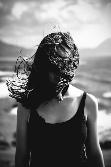 Woman with Hair Blowing Over Face