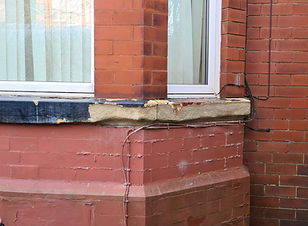 This is a stone cill / sill in need of repair
