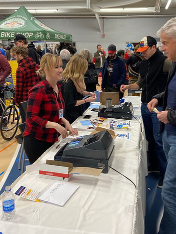 Volunteers at the front table checking people into the swap