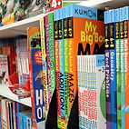 A selection of children’s books displayed on a bookshelf at Kids Den