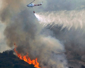 Cooler weather helps crews battling Western wildfires