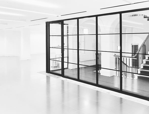 Modern black framed fire-resistant glass partition and screen installation
