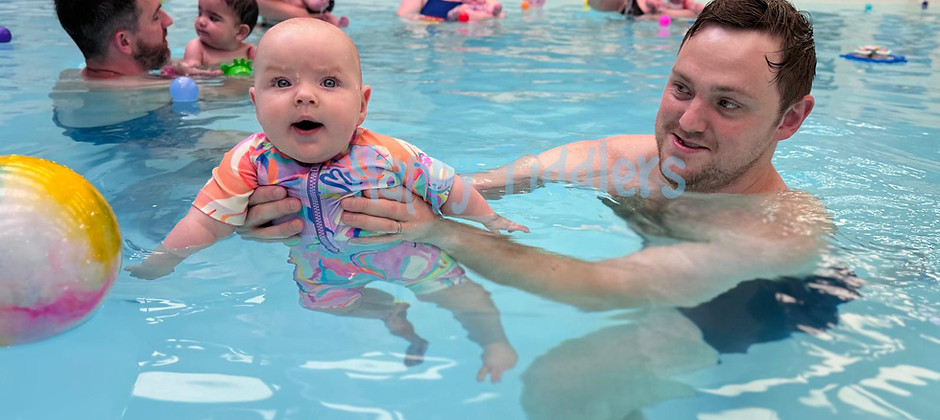 Happy Tiddlers playing in the pool