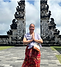 Allison Coleman at Lempuyang Temple in Bali, Indonesia, overlooking the iconic Gates of Heaven and Mount Agung.
