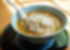 A bowl of miso ramen with miso paste-based broth, noodles, and toppings like bean sprouts and butter.