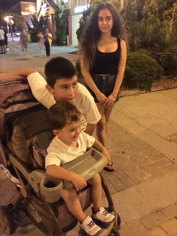 Undated photo of "Kathy Alexis Pereira" along with unidentified young companions (full photo).