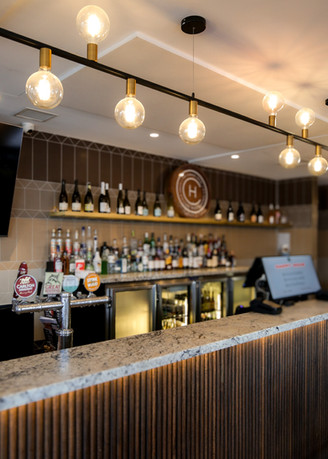 50mm acoustic ceiling panels in Nude White, installed over the drinks bar at The Camden Hotel in Caulfield by BACH Commercial