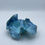 Thumbnail: Handbuilt pottery trinket bowl in blue glaze with sculptural ruffled edges and organic marbled surface texture