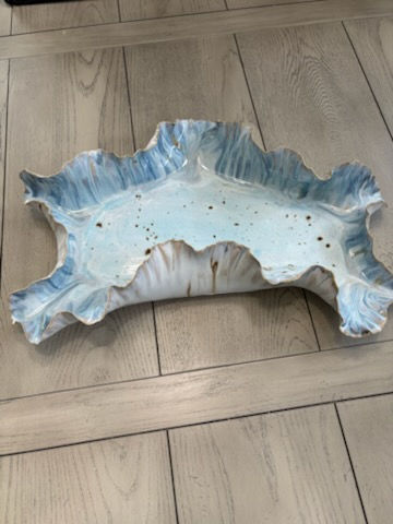 Thumbnail: Handbuilt blue and white ruffled stoneware serving platter with a wave-like sculptural edge and speckled glaze finish.
