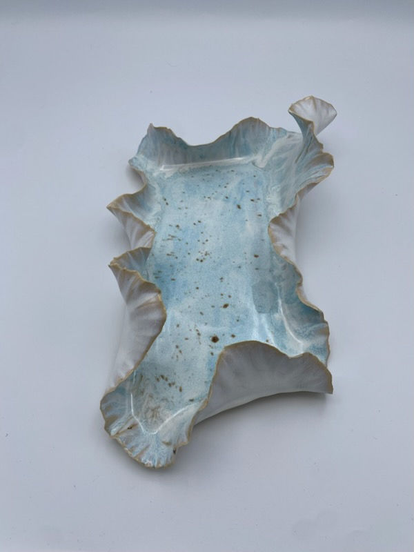 Thumbnail: Luxury sculptural coastal platter in light blue speckled glaze handmade in Charlotte, soft ruffled edge