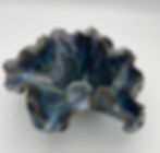 Dark Blue ceramic bowl with ruffled edges on a white background, featuring a marbled pattern and glossy finish.
