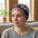A woman wearing headwear for chemo patients featuring a pink hat and blue headband