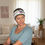 Thumbnail: A woman wearing a mocham colour chemo hat featuring a detachable floral headband