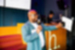 Leadership Development Executive speaking at event with microphone