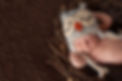 baby with an owl hat sleeping peacefully