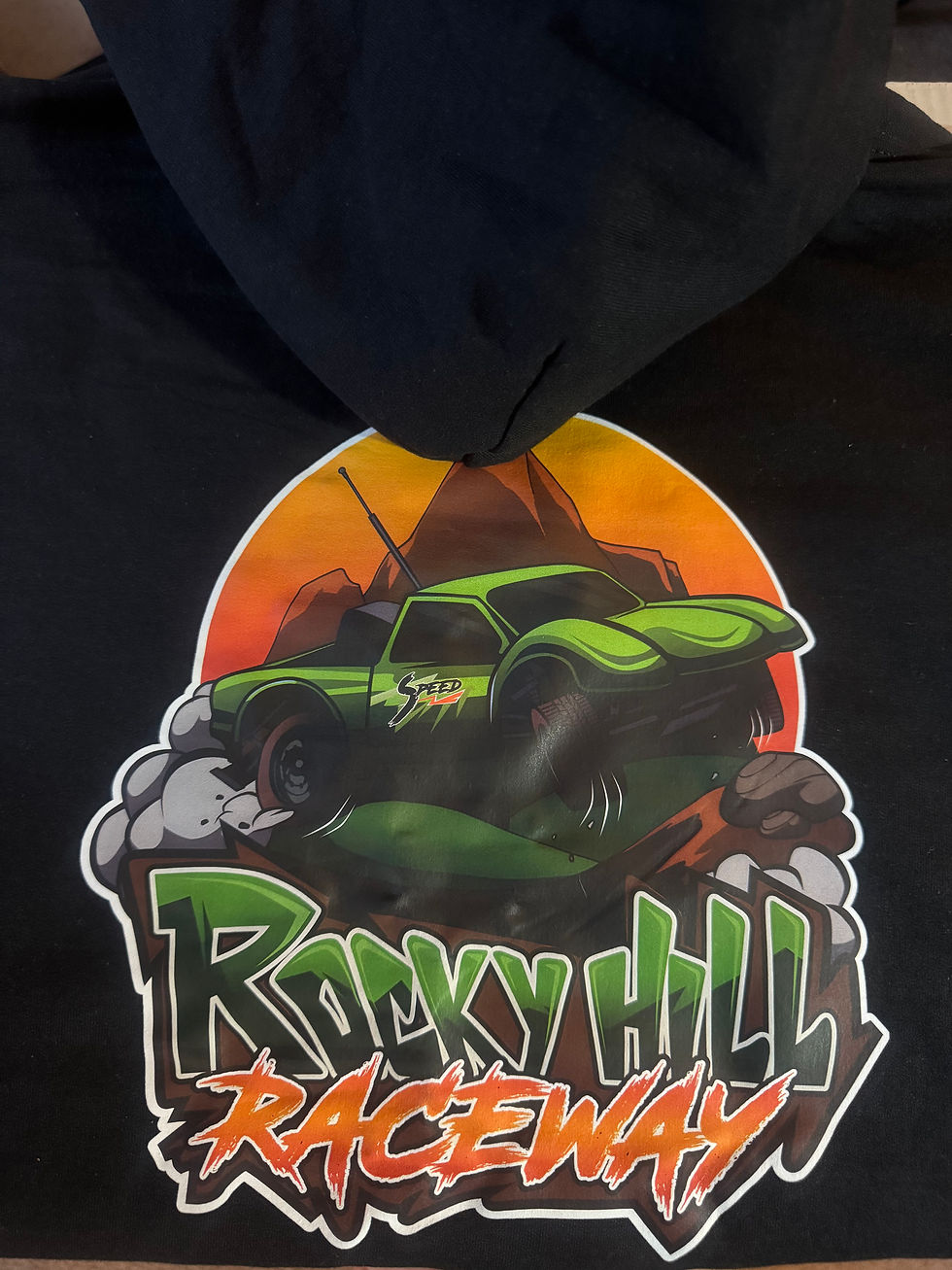 Rocky Hill Raceway hoodie with green performance truck graphic