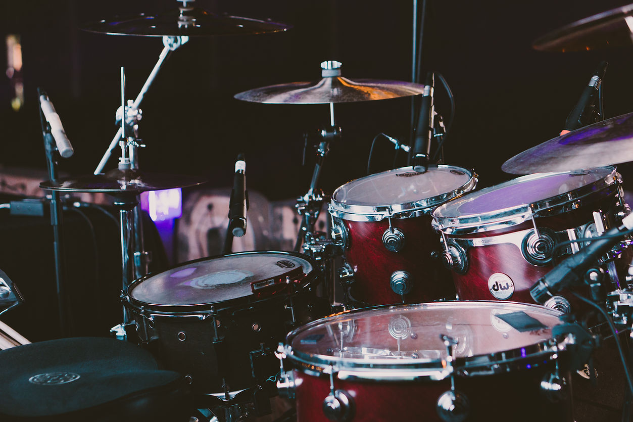 Cherry red DW drum kiton a stage.