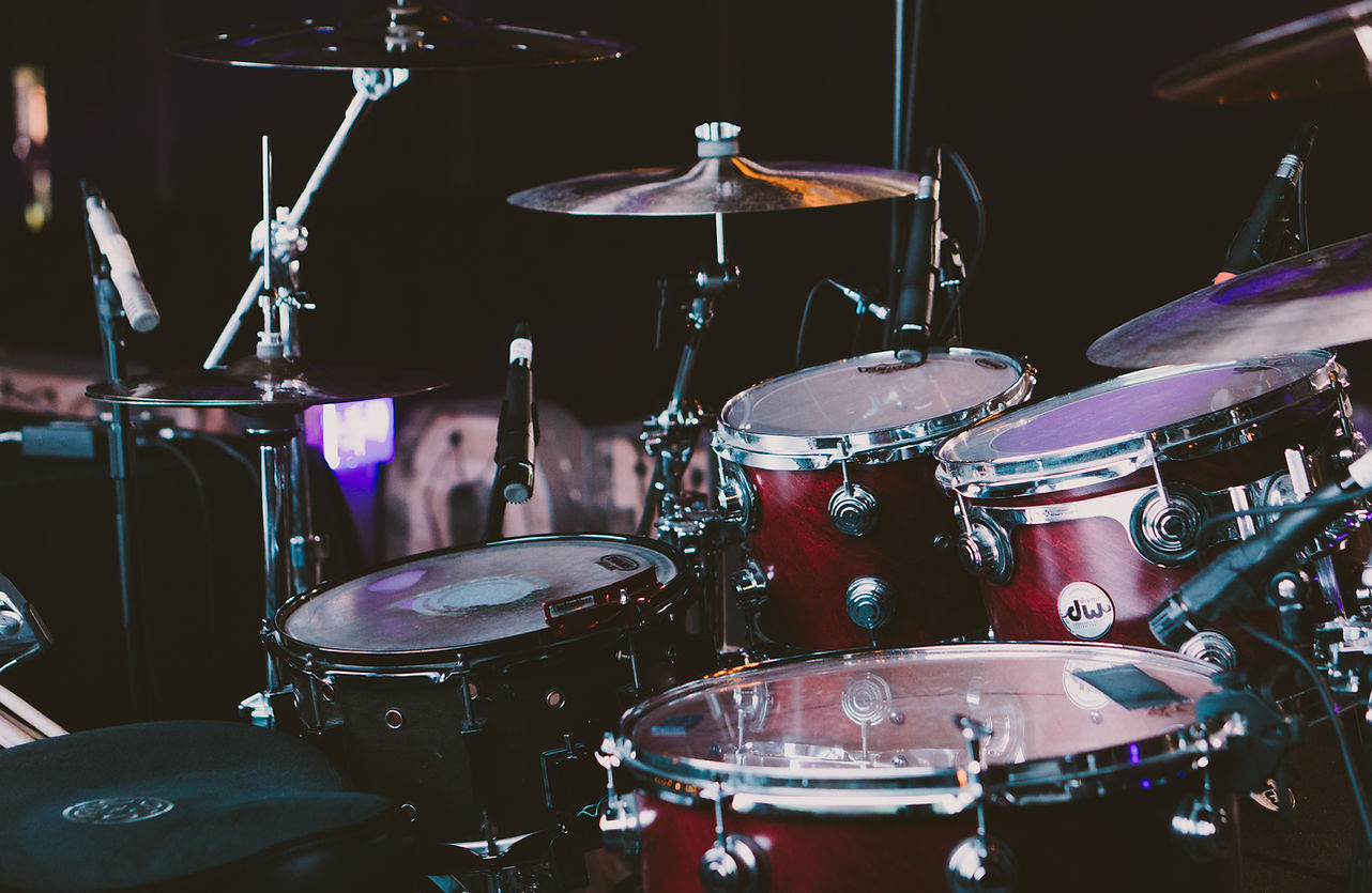 Cherry red DW drum kiton a stage.