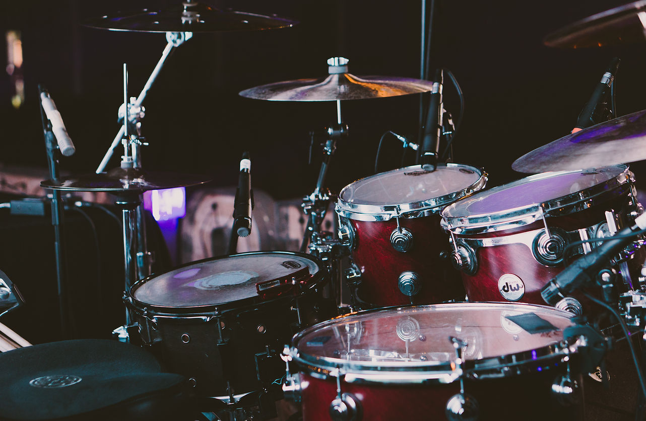 Cherry red DW drum kiton a stage.